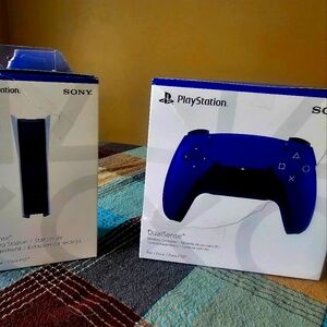 One purple PS5 controller and one PS5 docking station.